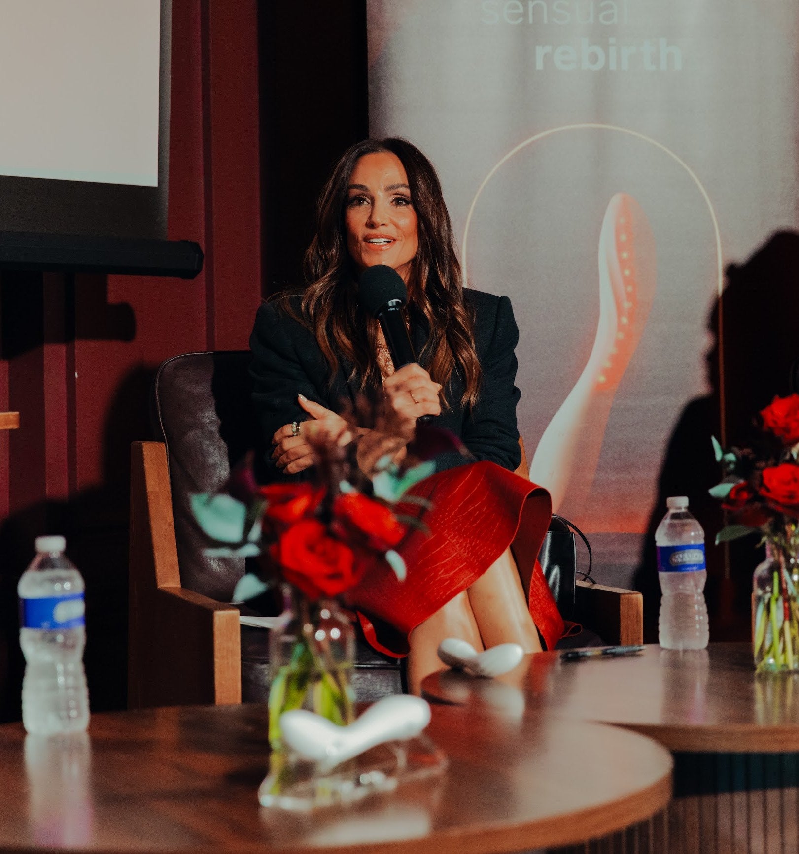 Dr. Emily Morse on stage at a Playground panel